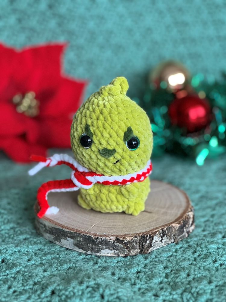 Grinch mini crocheted plush toy, handmade for the holidays.